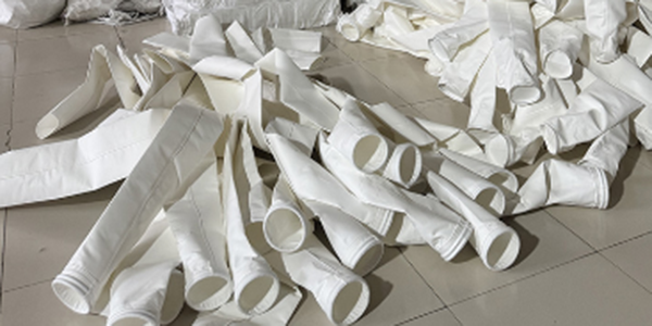 How often should the filter bags of a dust collector be replaced?